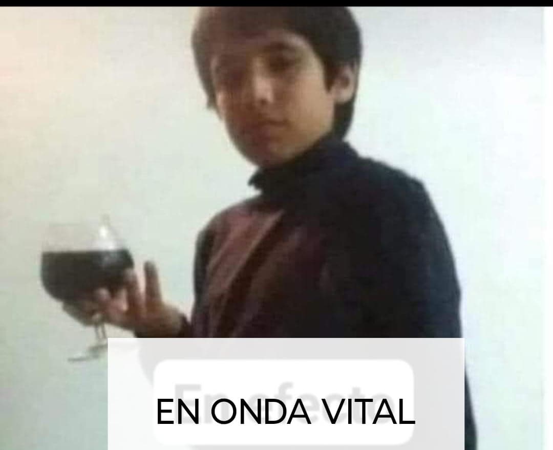 Kid In Formal Wear Holds Wine Glass