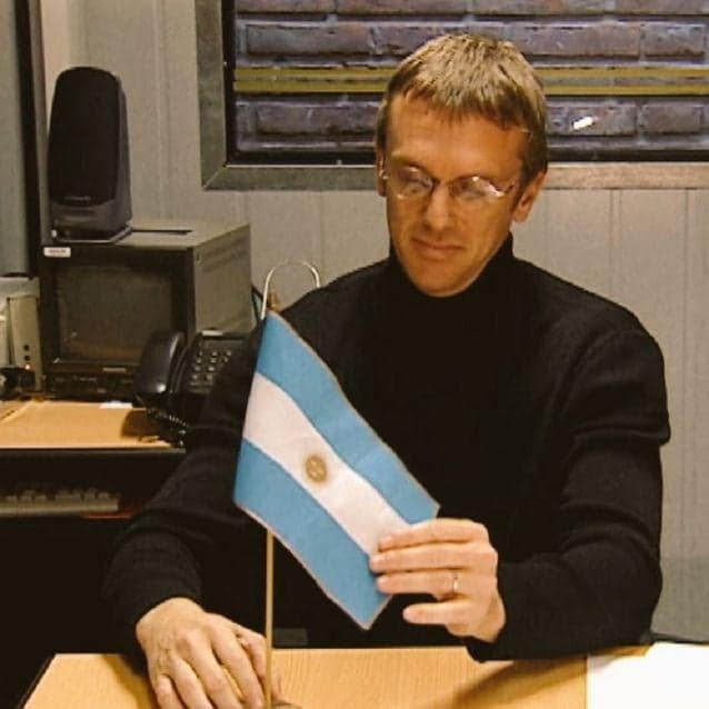 Man Intensely Stares at Argentine Flag