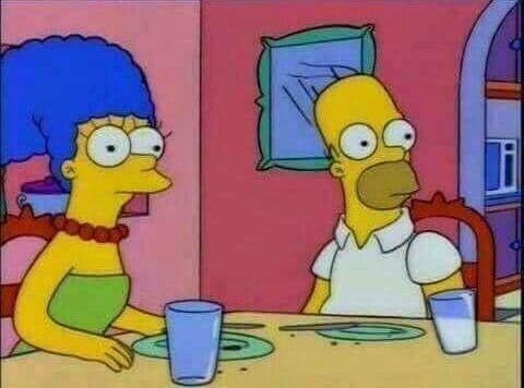 Homer And Marge Talk At The Kitchen Table