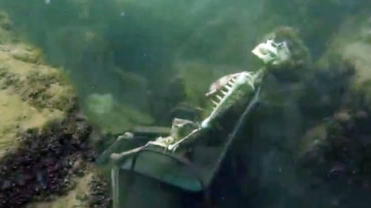 Skeleton Still Waiting Underwater in Lawn Chair