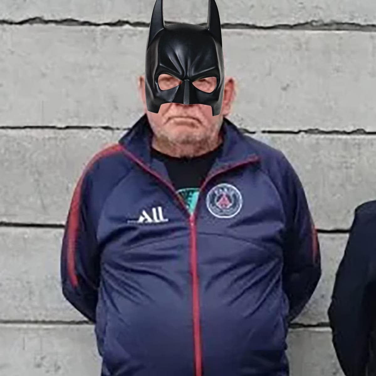 Grumpy PSG Fan Photoshopped With Batman Mask