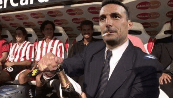 Scaloni Pops Champagne on the Bench